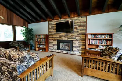a living room with a couch and a fireplace at Mammoth West #101 Condo in Mammoth Lakes