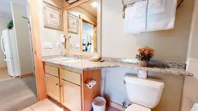 a bathroom with a toilet and a sink at Sunstone #208 Condo in Mammoth Lakes