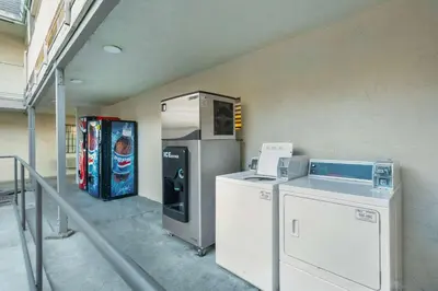 a room with a vending machine and a drink cooler at Motel 6-Merced, CA - North in Merced