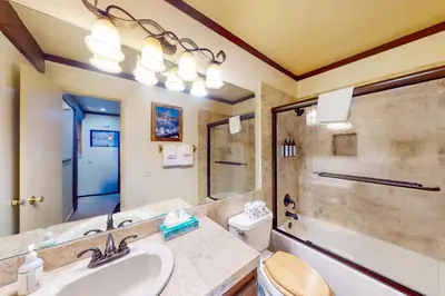 a bathroom with a sink and a shower at Mammoth Ski & Racquet Club #131 in Mammoth Lakes