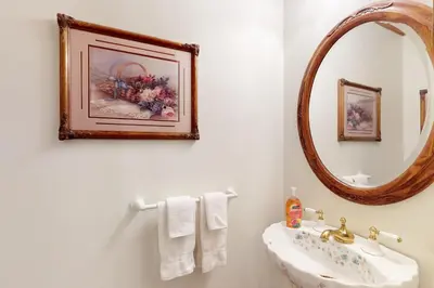 a bathroom with a sink and a mirror at House on Cold Creek in South Lake Tahoe