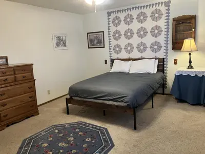 a bedroom with a bed and a dresser at House on Cold Creek in South Lake Tahoe