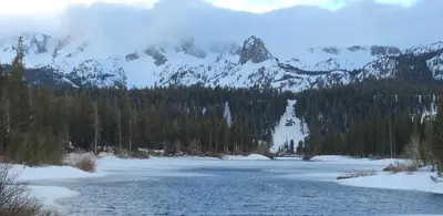 a view of a river with a snow covered mountain at Mountainback 38 pet unit in Mammoth Lakes