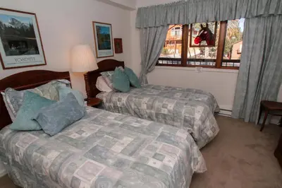 a hotel room with two beds and a window at Mountainback 38 pet unit in Mammoth Lakes