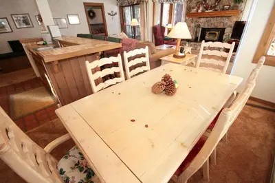a wooden table with pine cones on top of it at Mountainback 34 Corner in Mammoth Lakes