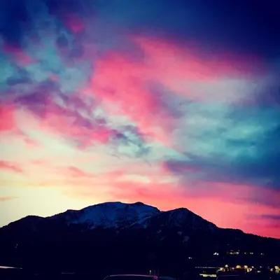 a colorful sky with a mountain in the background at Mountainback 49 Den in Mammoth Lakes