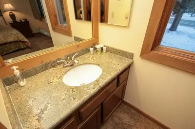 a bathroom with a sink and a mirror at Mountainback 49 Den in Mammoth Lakes