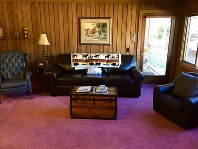 a living room with a couch and chairs and a table at Mountainback #74 in Mammoth Lakes
