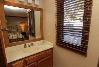 a bathroom with a sink and a mirror at Mountainback 73 Den in Mammoth Lakes