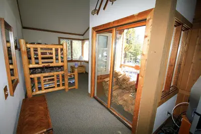 a room with a sliding glass door in a house at Mountainback 63 Loft Den in Mammoth Lakes