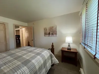 a bedroom with a bed and a lamp on a table at Mountainback 57 Den in Mammoth Lakes