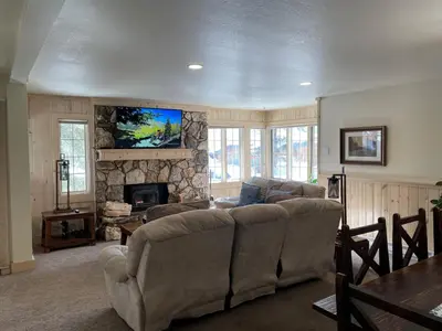 a living room with a couch and a fireplace at Mountainback 57 Den in Mammoth Lakes