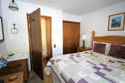 a bedroom with a bed and a sink at Discovery 4 115 in Mammoth Lakes
