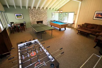 a living room with a ping pong table and a table tennis at Discovery 4 133 in Mammoth Lakes