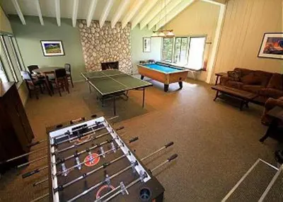 a living room with a ping pong table and a room with at Discovery 4 #135 in Mammoth Lakes