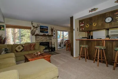 a living room with a couch and a fireplace at Discovery 4 137 in Mammoth Lakes