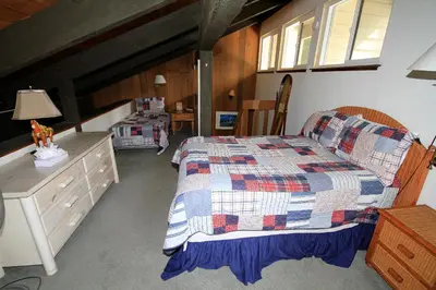 a bedroom with a bed and a dresser at Horizons 4 140 1 Bedroom Loft 1 Bath in Mammoth Lakes