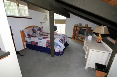 a bedroom with a bed and a television in it at Horizons 4 140 1 Bedroom Loft 1 Bath in Mammoth Lakes