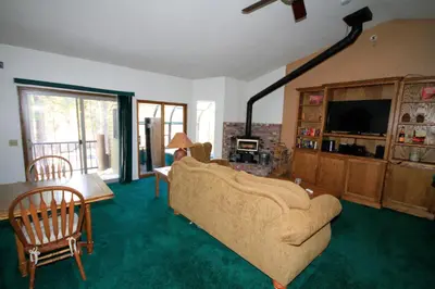 a living room with a couch and a tv at Forest Creek 3 Pet accepted in Mammoth Lakes