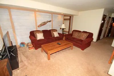 a living room with a couch and a coffee table at Discovery 4 153 in Mammoth Lakes