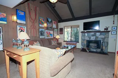 a living room with a couch and a fireplace at Discovery 4 142 Loft in Mammoth Lakes