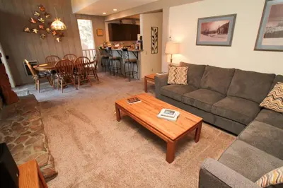 a living room with a couch and a table at Mammoth Ski & Racquet Club #84 in Mammoth Lakes