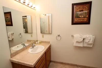 a bathroom with two sinks and a large mirror at Silver Bear #40 in Mammoth Lakes