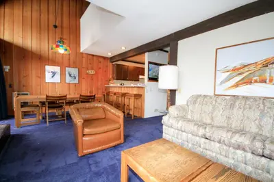 a living room with a couch and a table at Mammoth Ski Racquet Club 129 in Mammoth Lakes