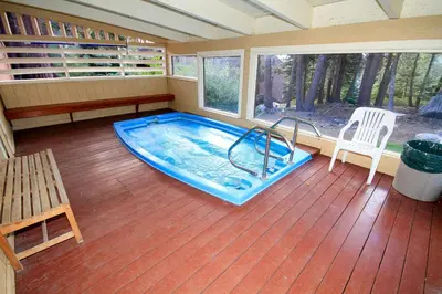 a room with a swimming pool in a house at Mammoth Ski Racquet Club 120 - Pet Friendly in Mammoth Lakes