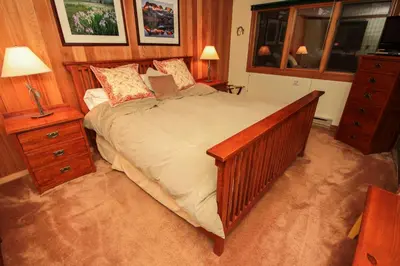 a bedroom with a large bed and a window at Mountainback 111 in Mammoth Lakes