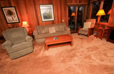 a living room with a couch and chairs and a table at Mountainback 111 in Mammoth Lakes