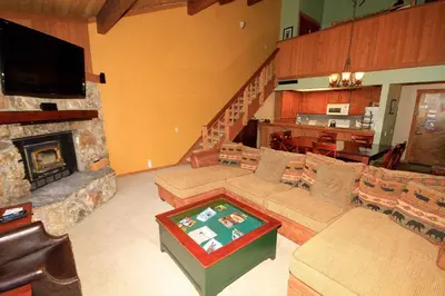 a living room with a couch and a fireplace at Mountainback 97 Loft in Mammoth Lakes