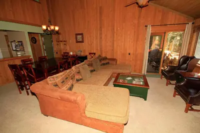a living room with couches and a dining room at Mountainback 97 Loft in Mammoth Lakes