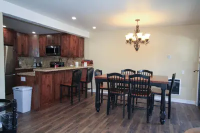 a kitchen with a table and chairs and a counter at Mammoth Ski Racquet Club 12 - Pet Friendly in Mammoth Lakes