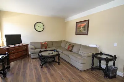 a living room with a couch and two tables at Mammoth Ski Racquet Club 12 - Pet Friendly in Mammoth Lakes