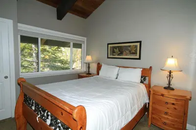 a bedroom with a large bed and a window at Mammoth Ski Racquet Club 38 - Pet ok - Loft in Mammoth Lakes