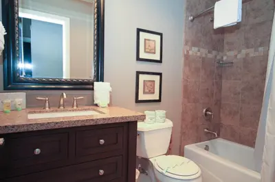 a bathroom with a sink and a toilet and a shower at Mammoth Ski Racquet Club 38 - Pet ok - Loft in Mammoth Lakes