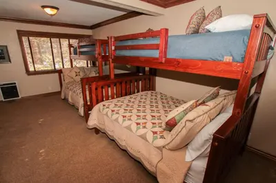 a bedroom with two bunk beds in a room at Mammoth Ski Racquet Club 34 in Mammoth Lakes