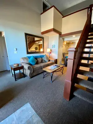 a living room with a couch and a table at Tahoe Lakeshore Lodge & Spa in South Lake Tahoe