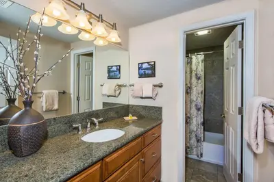 a bathroom with a sink and a mirror at Tahoe Lakeshore Lodge & Spa in South Lake Tahoe
