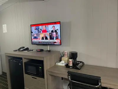 a flat screen tv sitting on top of a desk at Travel Inn in South Lake Tahoe
