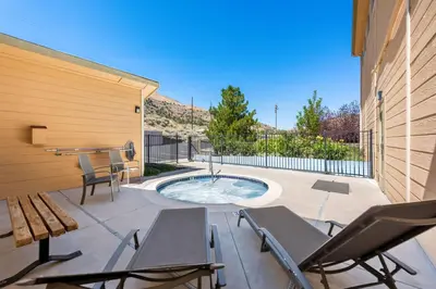 a patio with a table and chairs and a small pool at Best Western Topaz Lake Inn in Gardnerville