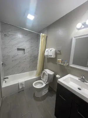 a bathroom with a white toilet and a sink at Tahoe Hacienda Inn in South Lake Tahoe