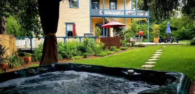 a bath tub in the yard of a house at American River Inn in Georgetown