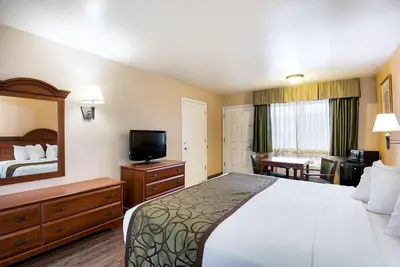 a hotel room with a bed and a television at SureStay Hotel by Best Western Fernley in Fernley