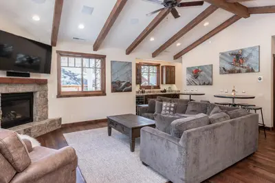 a living room with couches and a fireplace at Gray Bear 454 in Mammoth Lakes