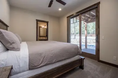 a bedroom with a bed and a large window at Gray Bear 454 in Mammoth Lakes