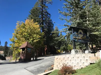 a sign for a restaurant on the side of a road at Mammoth Ski Racquet Club 74 1 Bdrm Loft in Mammoth Lakes
