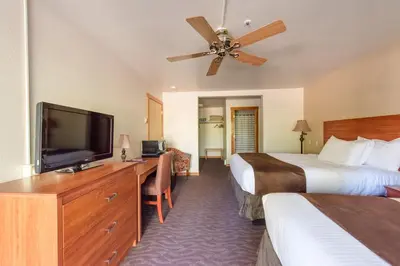 a hotel room with two beds and a flat screen tv at Granlibakken Tahoe in Tahoe City