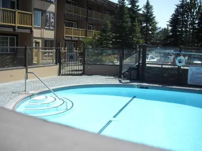 a large swimming pool in a apartment complex at The Tahoe Beach & Ski Club Owners Association in South Lake Tahoe